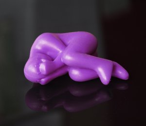 Purple rubber man stress toy
