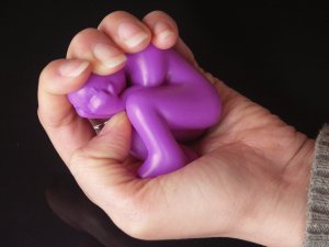 Squeezable stress ball shaped like a stressed out man