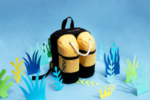 Scuba diver backpack amongst paper seaweed