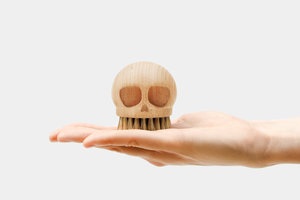 wooden skull brush in hand