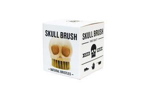 wooden skull brush in packaging