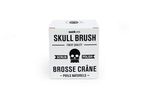 wooden skull brush in packaging