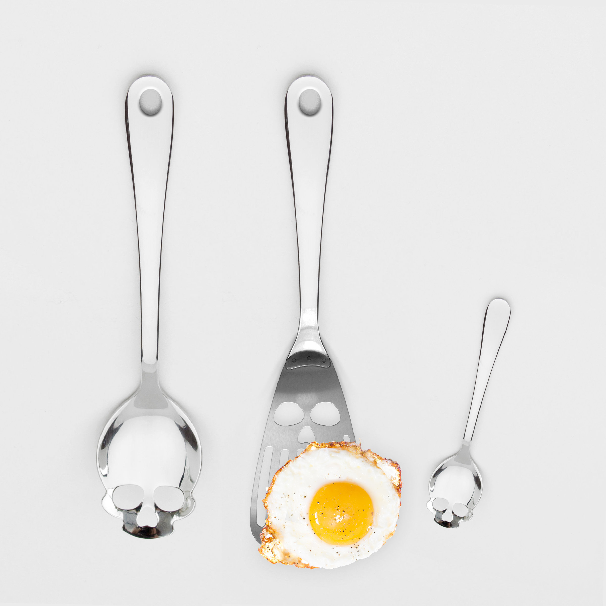 Skull Kitchen Spatula Skull faced stainless steel cooking utensil.